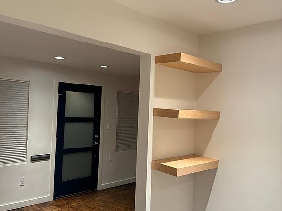 Kitchen Shelves and View of Front Door