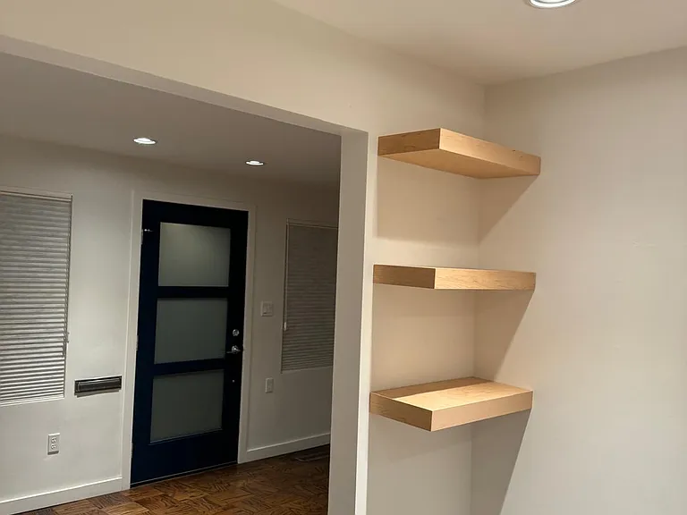 Kitchen Shelves and View of Front Door