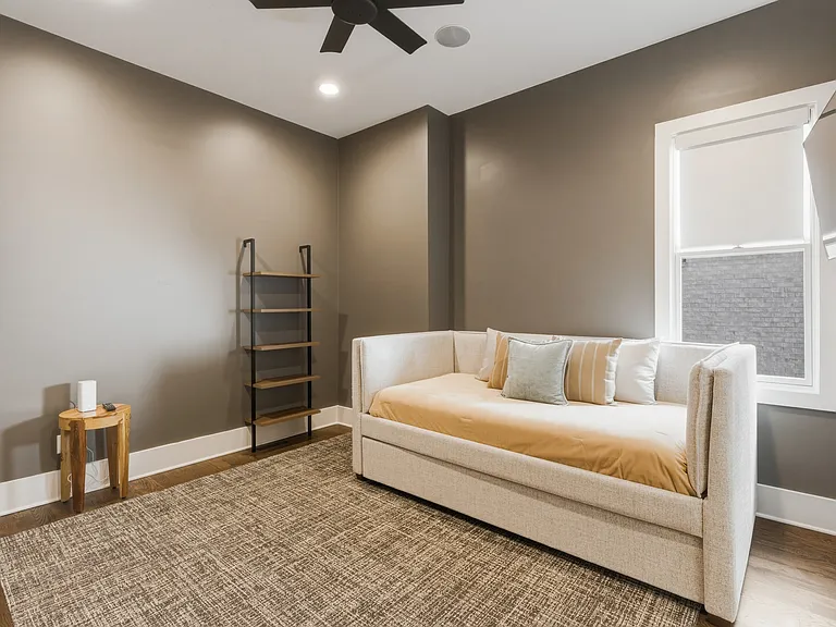 Bedroom #3 features a cozy trundle bed with attached closet, smart TV and convenient Jack-and-Jill bathroom_offering both privacy and easy access for guests.