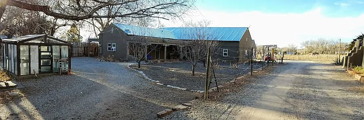 Casa Nambe is the left portion of the "L"-shaped roof-line. Casa Merlot is the right-side portion. The greenhouse is available for use.