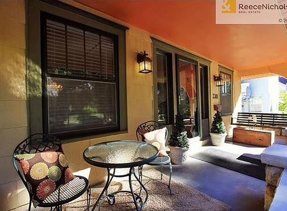 You will feel so comfortable on this front porch enjoying the pretty weather, visiting and just relaxing!