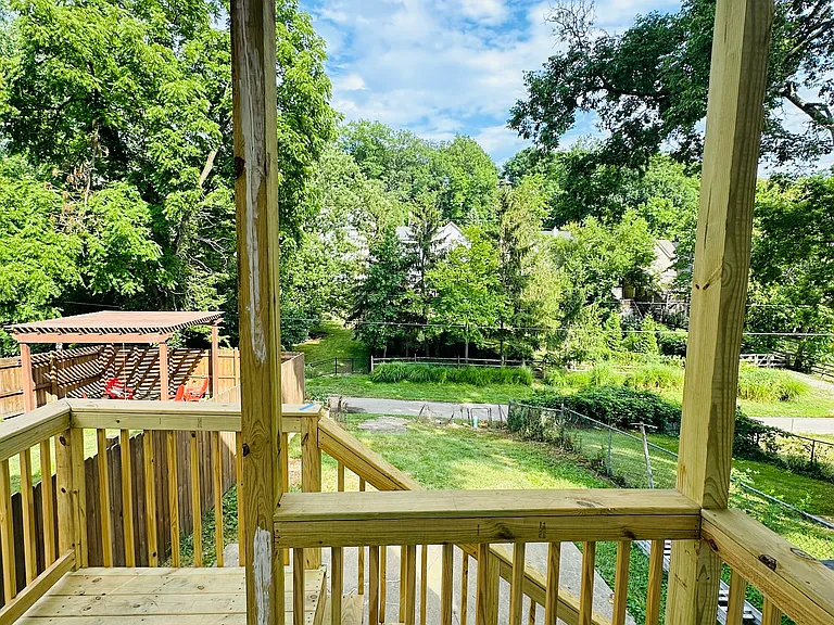 Back deck (to be painted) and patio/backyard.