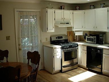 Wooden floor and two skylights in large kitchen