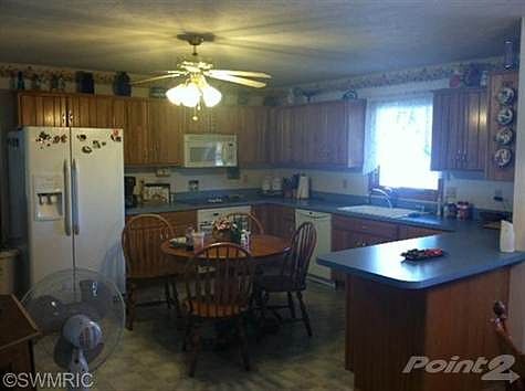 This large open concept kitchen has a lot of cupboard and counter space and is a wonderful roomy space to enjoy making holiday meals in! Plenty of room for kitchen conversation as you bake!