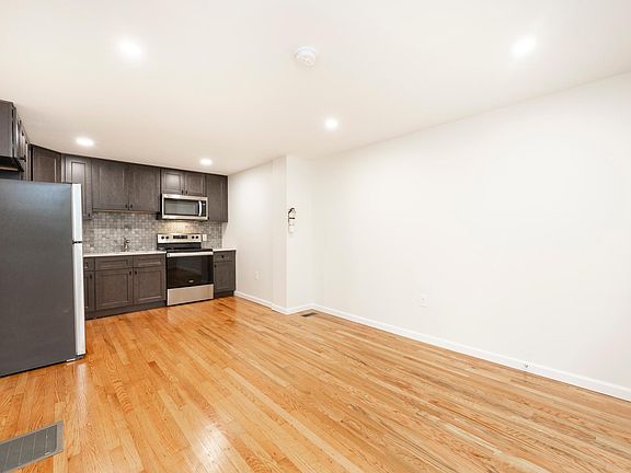 Open concept living area with new kitchen