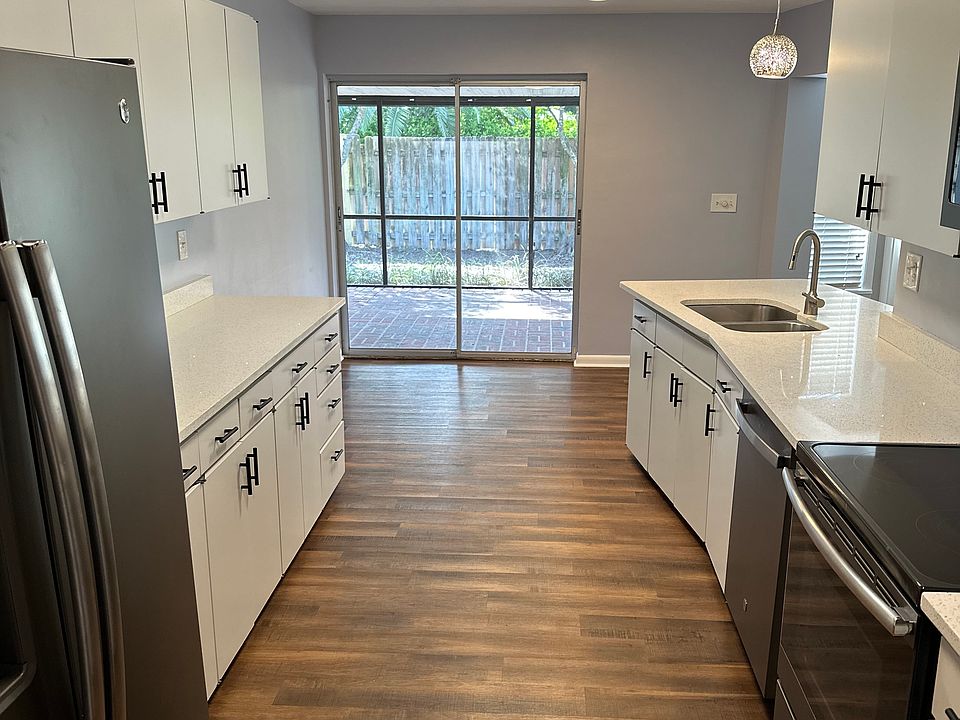 Galley kitchen to screened-in porch.