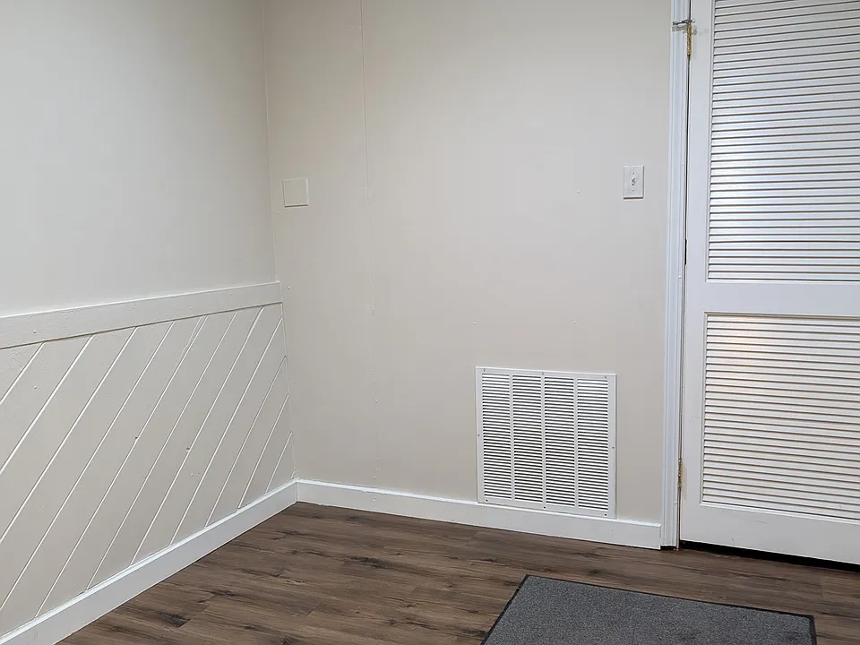 Bedroom Two with exit to back parking lot.