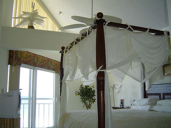 Master bedroom with glass sliders to balcony overlooking the Gulf!