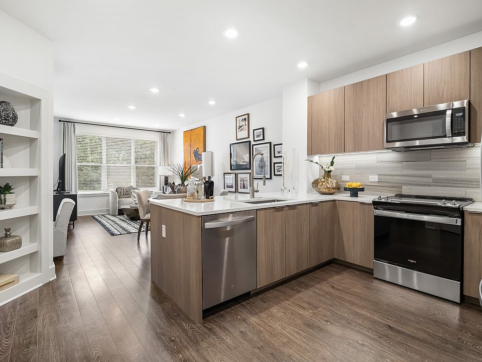 Chef-inspired kitchen with stone countertops and custom cabinetry