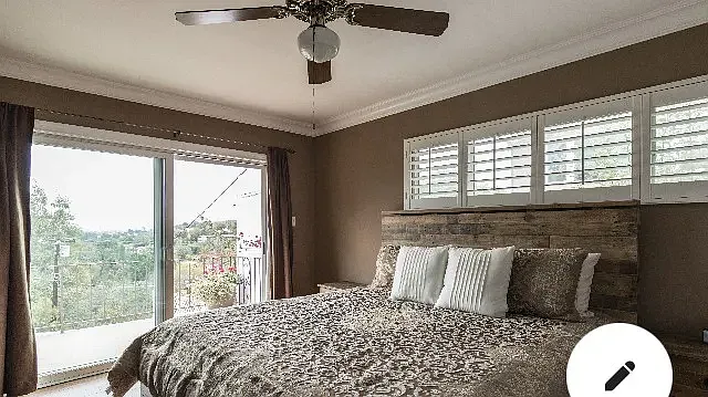 Upstairs master bedroom opend to balcony.
