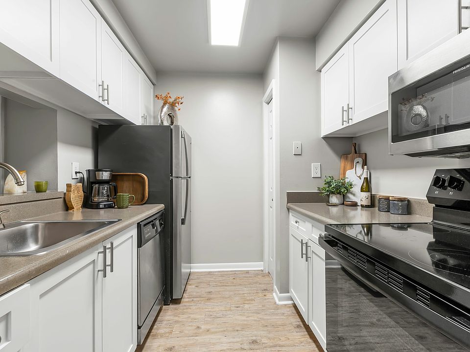 Stainless Steel Appliances and Gooseneck Sink Faucet