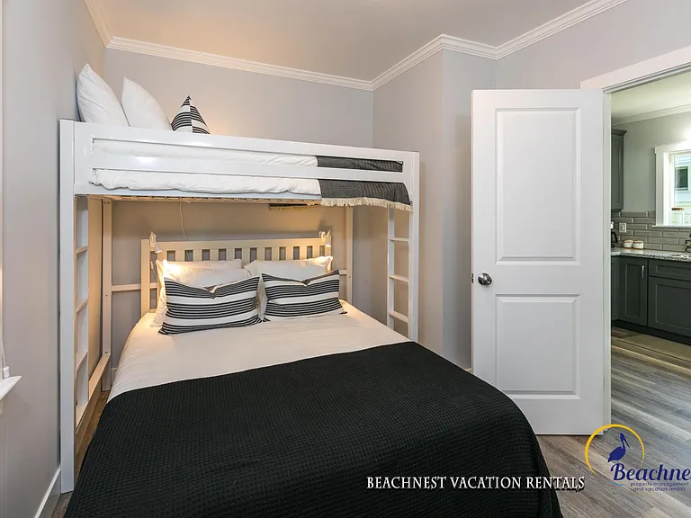 Second bedroom feature a pyramid bed configuration - full bed on the bottom and twin bed on the top.
