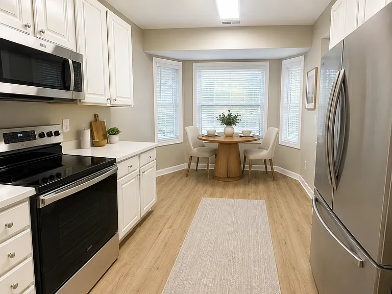 kitchen and nook area with new stainless steel appliances