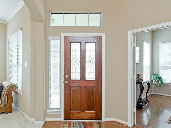 Foyer is open to the dining room and study.