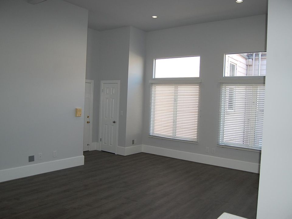 The entry viewed across the living area from the kitchen