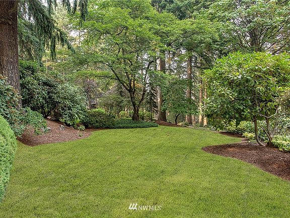 Manicured landscaping, quiet peaceful neighborhood.