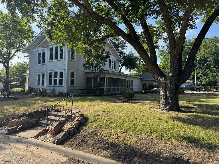 Large lot with beautiful landscaping and large trees