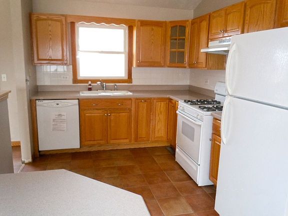 Kitchen With Lots of Cabinet Space and Beautiful Tile Flooring