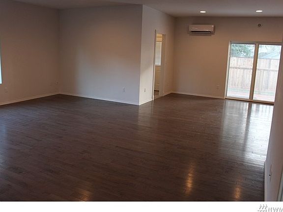 View from great room towards dining area. Efficient mini split ductless heat system.