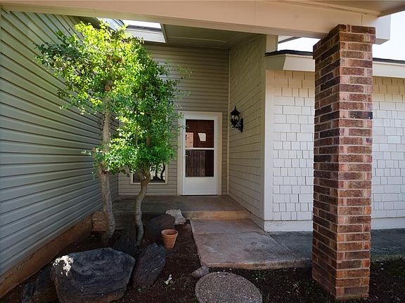 Front door - easy maintenance vinyl siding.