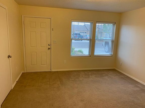 Living Room opens into kitchen/dining.