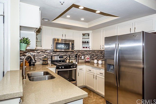 Beautiful upgraded kitchen with stainless appliances, granite counter top and tile back splash.