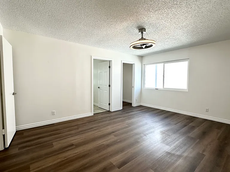 Primary master bedroom on second floor with walk-in closet and private bathroom
