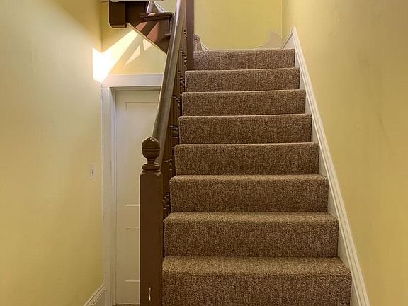 Upstairs hallway provides room for bicycle storage.