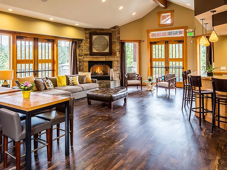 Resident clubhouse with fireplace, kitchen and coffee bar