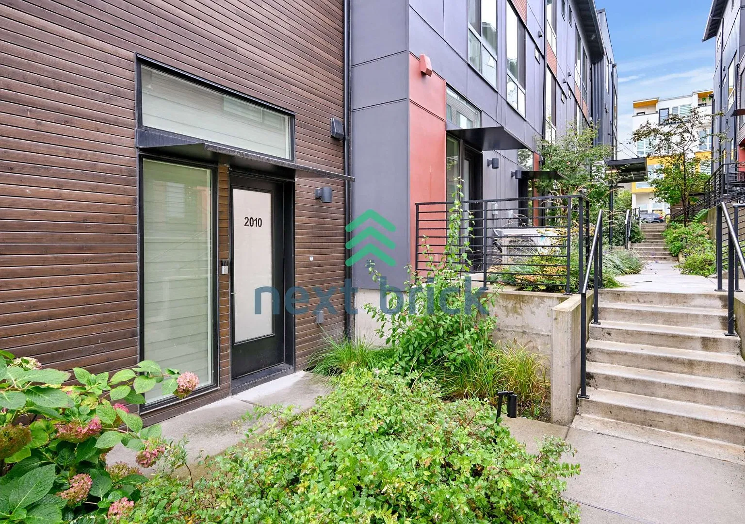 "Modern 3-Bedroom End-Unit Townhome with Spacious Deck, Quartz Kitchen & Convenient Transit Access" — Photo 3