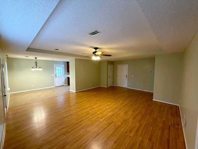 Wide view of the open living and dining areas