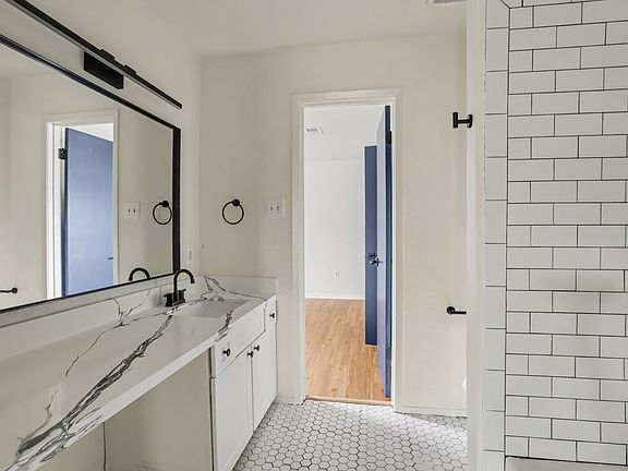 Bathroom with quartz countertops.