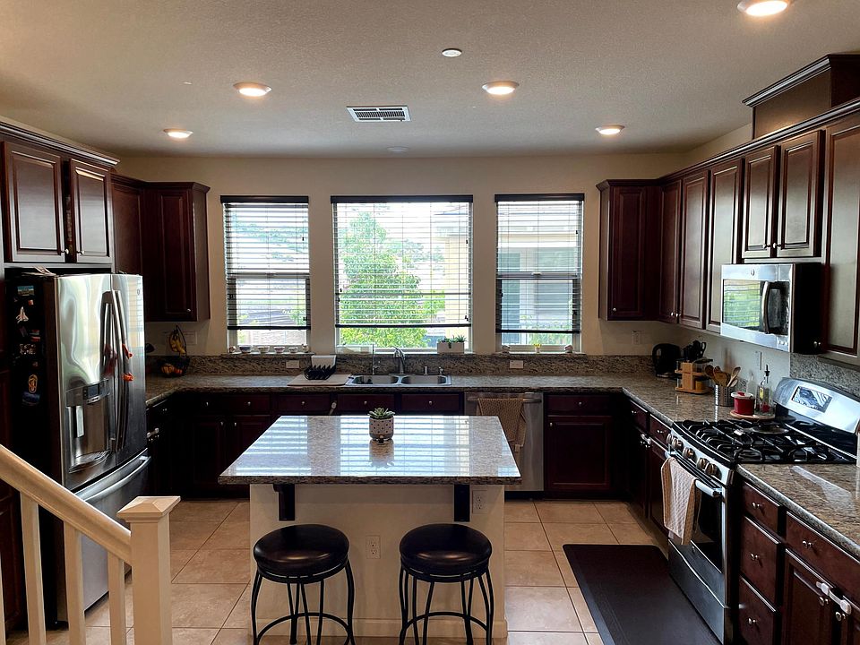 Kitchen with Stainless Steel appliances.