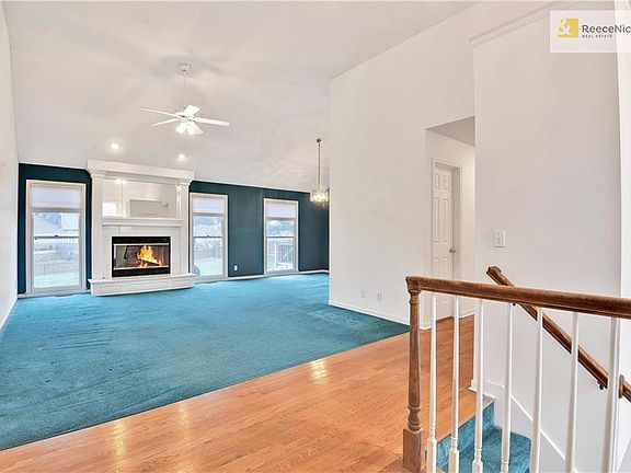 Open entry with vaulted ceilings in great room.  Would look great with added hardwoods!