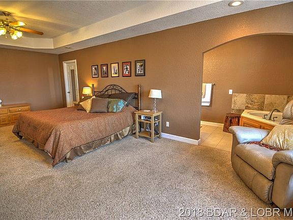 The master bedroom is quite large, with a walk-in closet, private bath, and access to the deck.