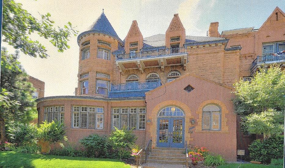Building Front. Loft #32 is second floor over the doors with the balcony railing and turret.