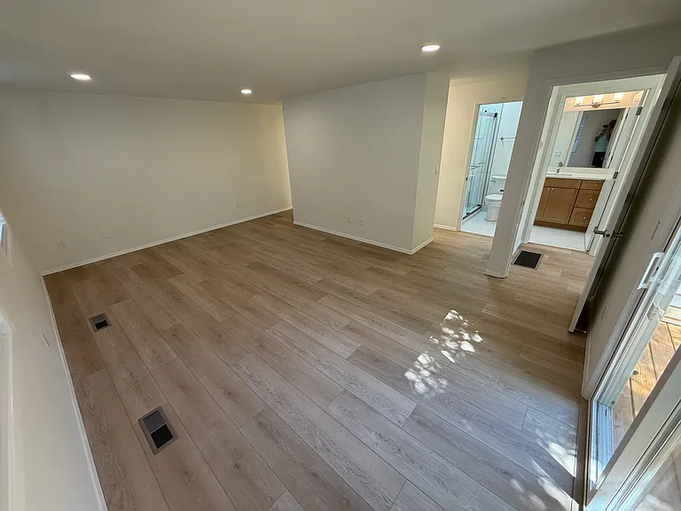 Doorways into landing nook and full bathroom.