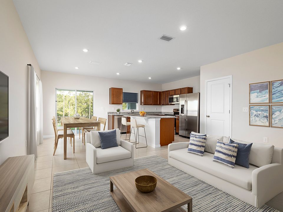 LOW-MAINTENANCE TOWNHOMES WITH AN ATTACHED GARAGE IS JUST ONE MILE FROM I-95.