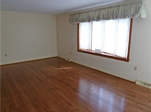 Beautiful hardwood floors and bay window makes this a great living room!