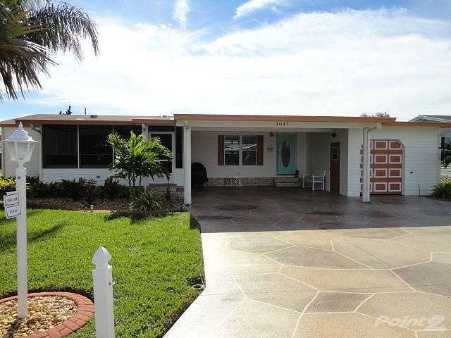 Freshly painted shutters, trim and drive