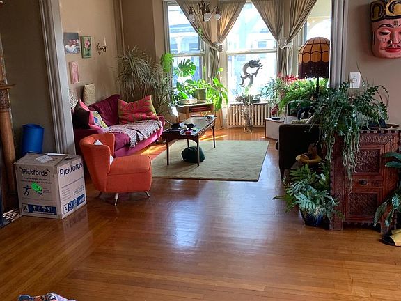 East facing LR from parlor , 3 bay windows to street