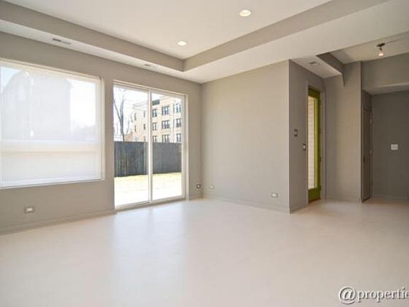 First floor living room w/sliding glass door to large yard
