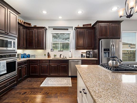 Large Island Kitchen with Gas Cooktop, Stainless Appliances, Including 3 Door Refrigerator, Granite Counters and a Great View While Washing Dishes!