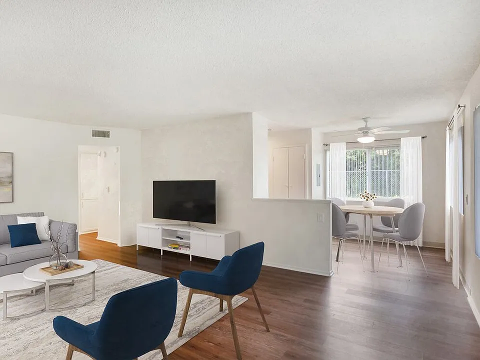 Renovated Package I living and dining area with hard surface flooring