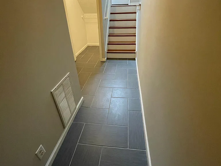 Garage entry and walkway to bonus room