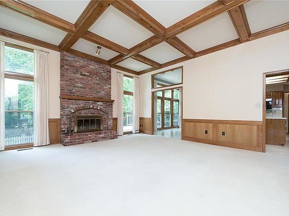 GREAT ROOM HAS FLOOR TO CEILING WINDOWS AND GAS FIRE PLACE