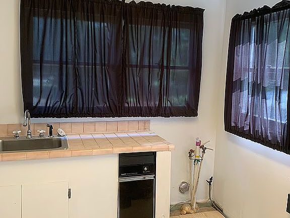 Washer/dryer room with sink 