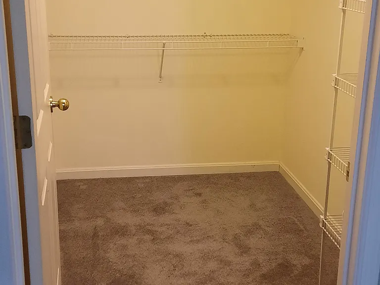 Master Closet, plenty of shelving and hanging space.