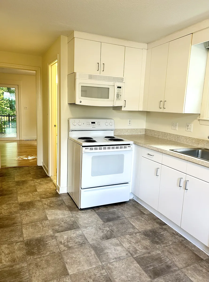 New stainless steel kitchen with granite counter tops currently being installed - Hawthorne Village