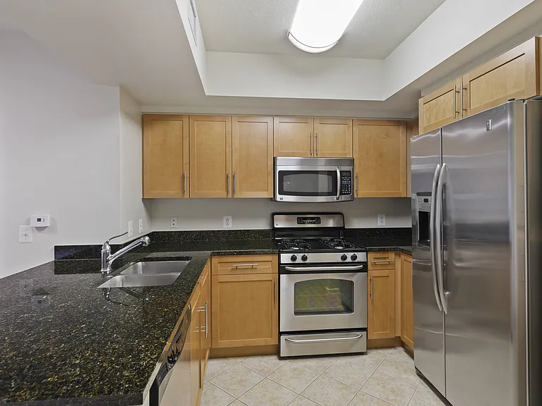 Modern Kitchen with Dishwasher, Disposal, Pantries, and Microwaves